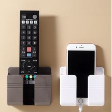Suporte Multiuso De Parede Para Celular e Controle Remoto